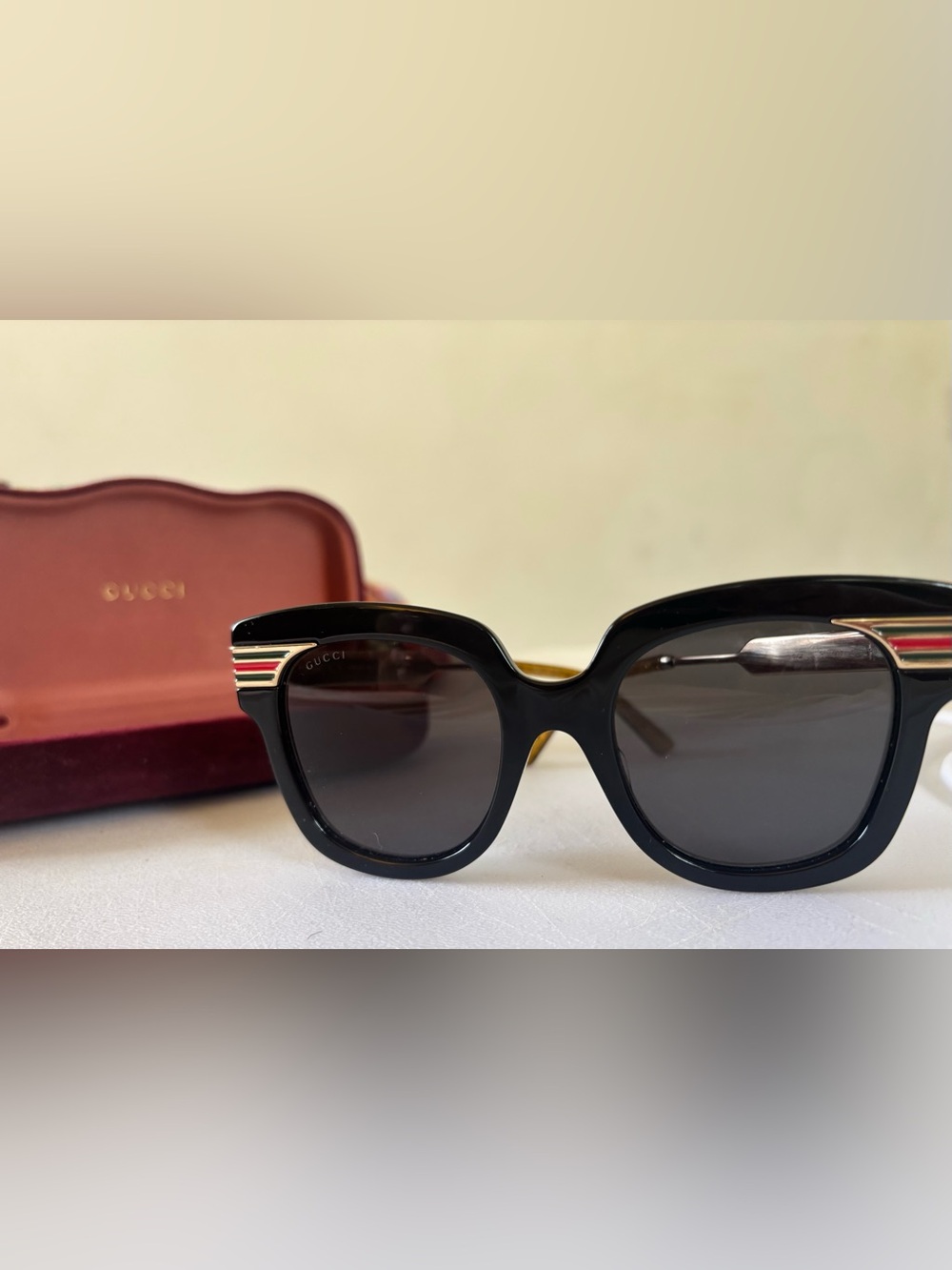 Gucci GG0281S Black Sunglasses with Red & Green Temple Stripes.